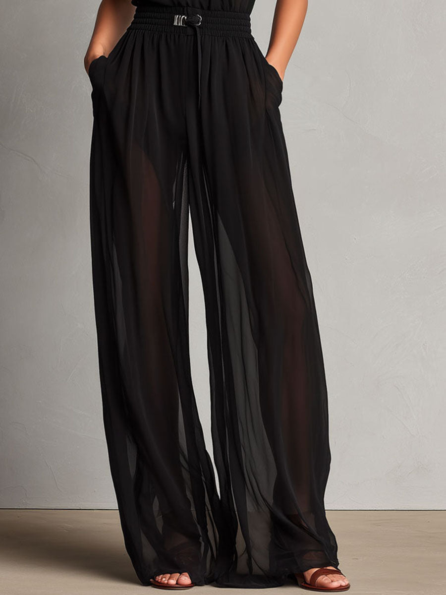 Jumpsuit nera con collo alto trasparente – dettaglio 9