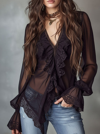 Blusa in chiffon nero con volant – in movimento
