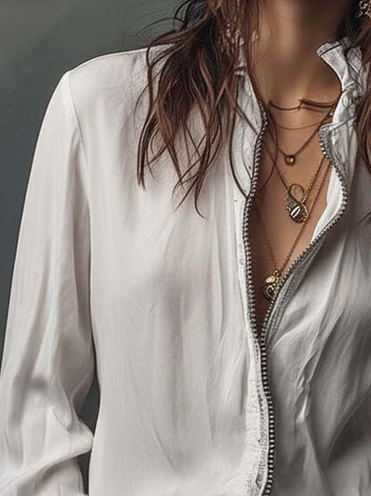 Blusa con zip sul davanti e polsini con volant – dettaglio 7