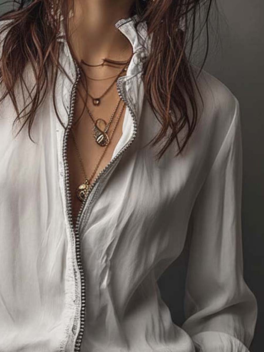 Blusa con zip sul davanti e polsini con volant – dettaglio 11