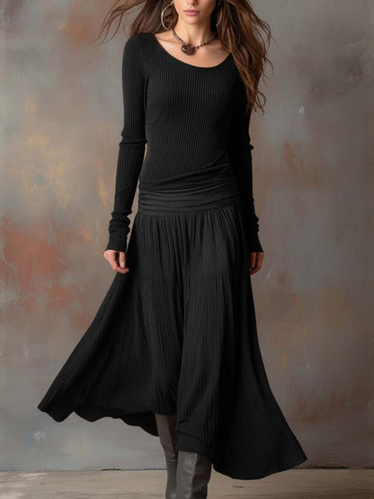Vestito lungo in maglia a coste con gonna plissé – dettaglio
