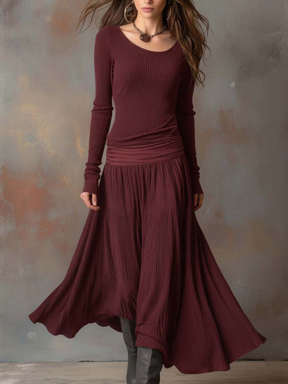 Vestito lungo in maglia a coste con gonna plissé – vista laterale