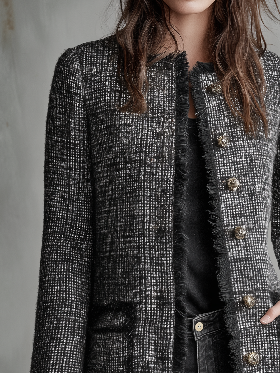 Cappotto in tweed nero – dettaglio delle frange