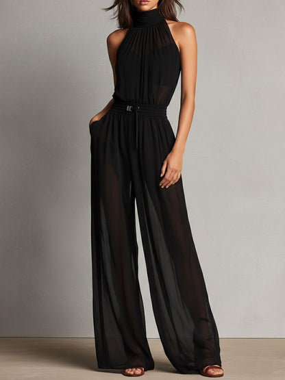 Jumpsuit nera con collo alto trasparente – dettaglio 4