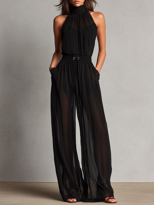 Jumpsuit nera con collo alto trasparente – vista frontale
