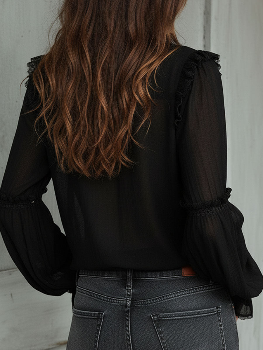 Blusa vintage nera con volant – vista posteriore
