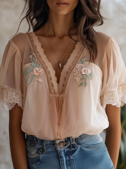 Camicetta boho rosa in chiffon con ricamo floreale – vista frontale