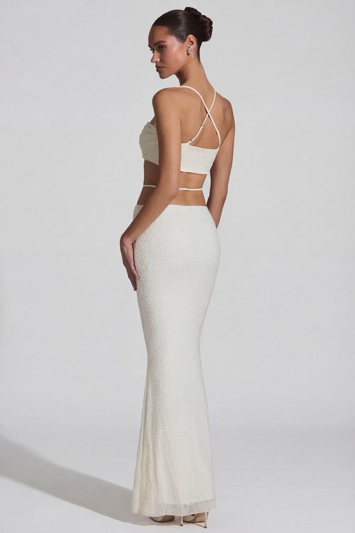 Top bianco con spalline incrociate – foto 4