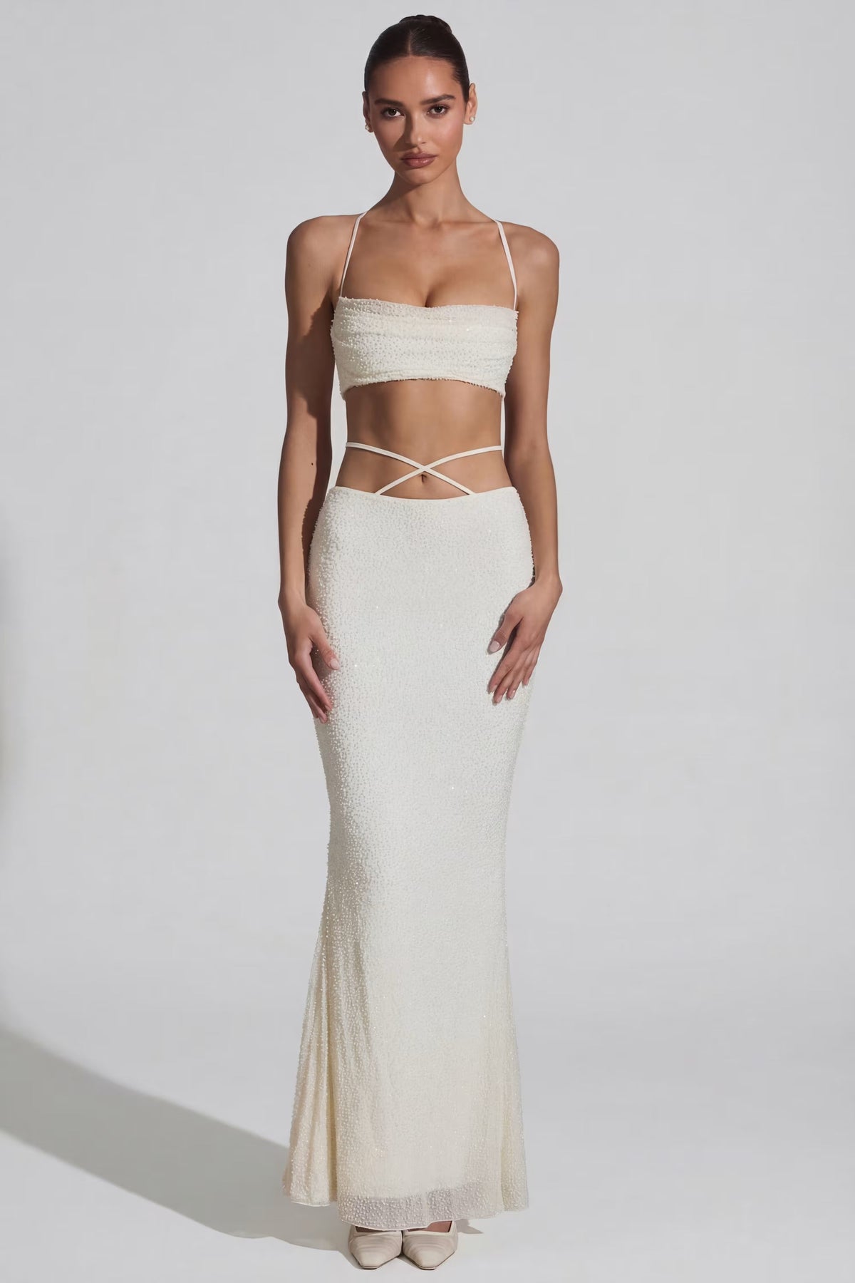 Top bianco con spalline incrociate – foto 1