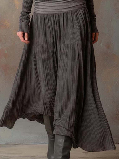 Vestito lungo in maglia a coste con gonna plissé – dettaglio
