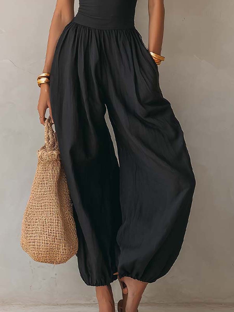 Tuta halter nera con pantaloni a palloncino – look completo